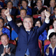 South Korea’s presidential candidate Moon Jae-in of the Democratic Party raises his hands as his party leaders and members watch on television local media’s results of exit polls for the presidential election in Seoul, South Korea, Tuesday, May 9, 2017. Exit polls forecast that liberal candidate Moon will win the election Tuesday to succeed ousted President Park Geun-hye. Official results weren’t expected for hours, but the exit poll of about 89,000 voters at 330 polling stations, jointly commissioned by three major television stations and released just after polls closed, showed Moon receiving 41.4 percent of the vote. (AP Photo/Ahn Young-joon)